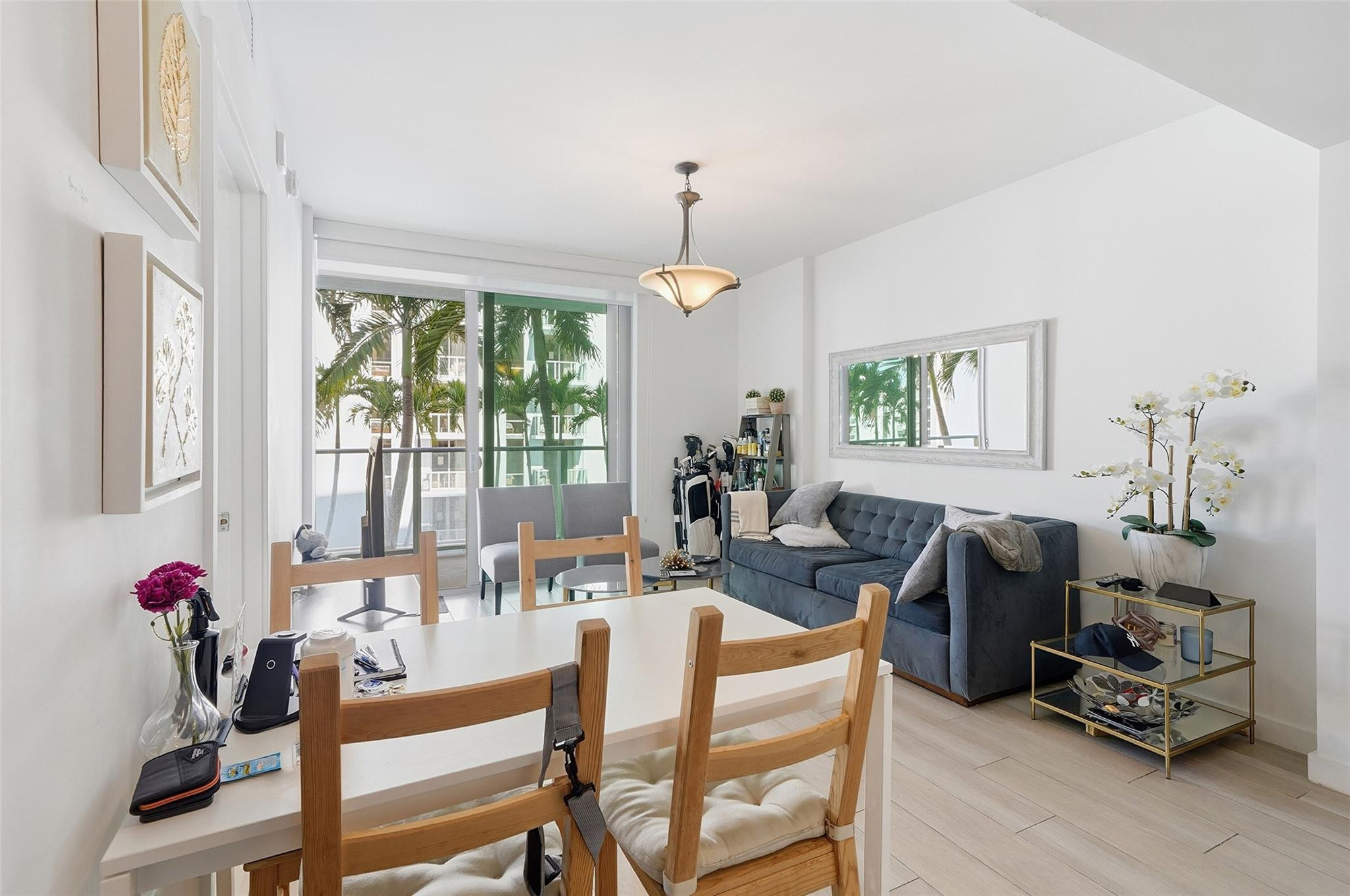1600 Southwest 1st Avenue, Unit 510 Miami, FL 33129 - Photo 12 of 75 a dining room with furniture mountain view and a chandelier