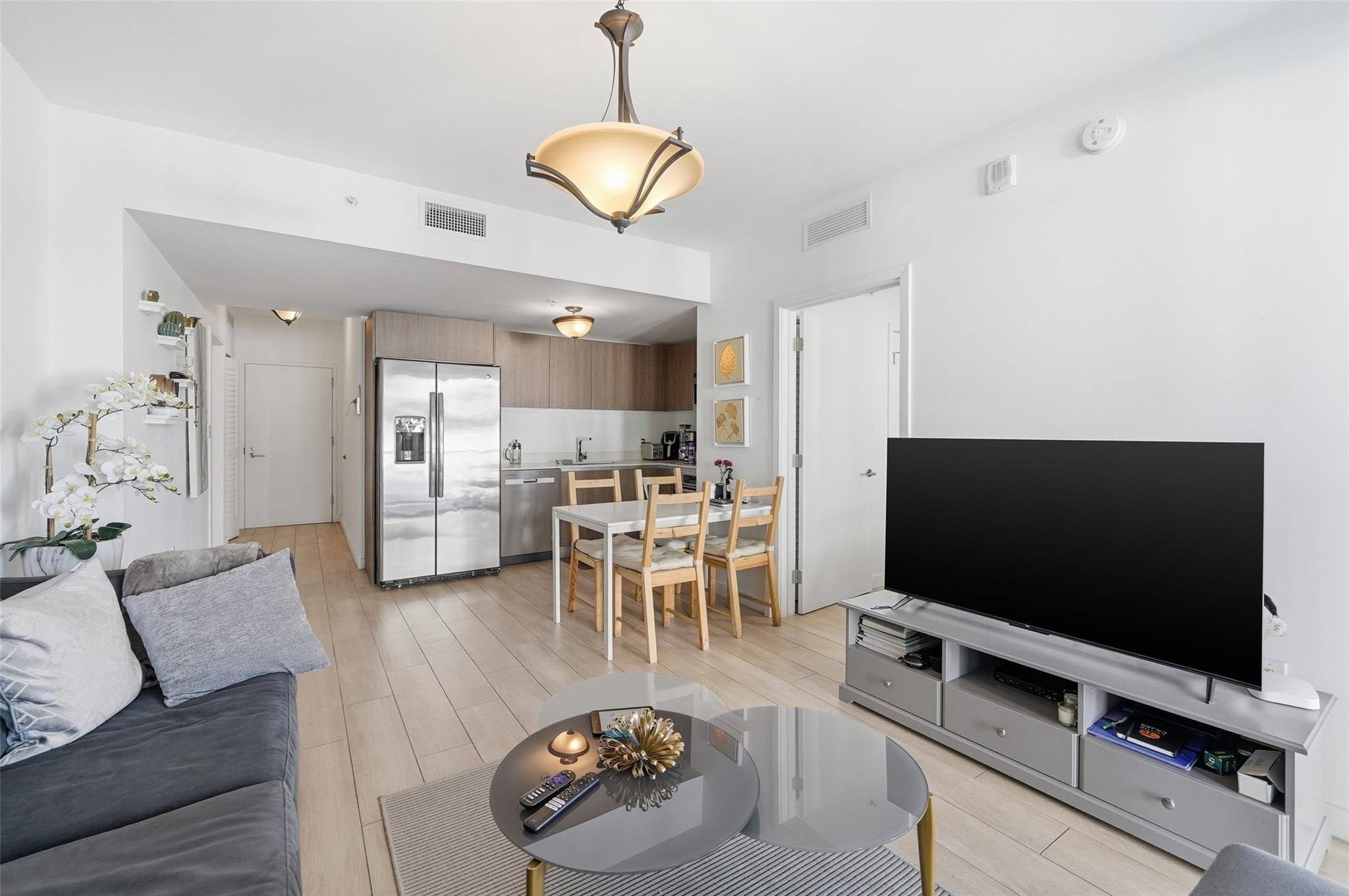 1600 Southwest 1st Avenue, Unit 510 Miami, FL 33129 - Photo 17 of 75 a living room with furniture and a flat screen tv