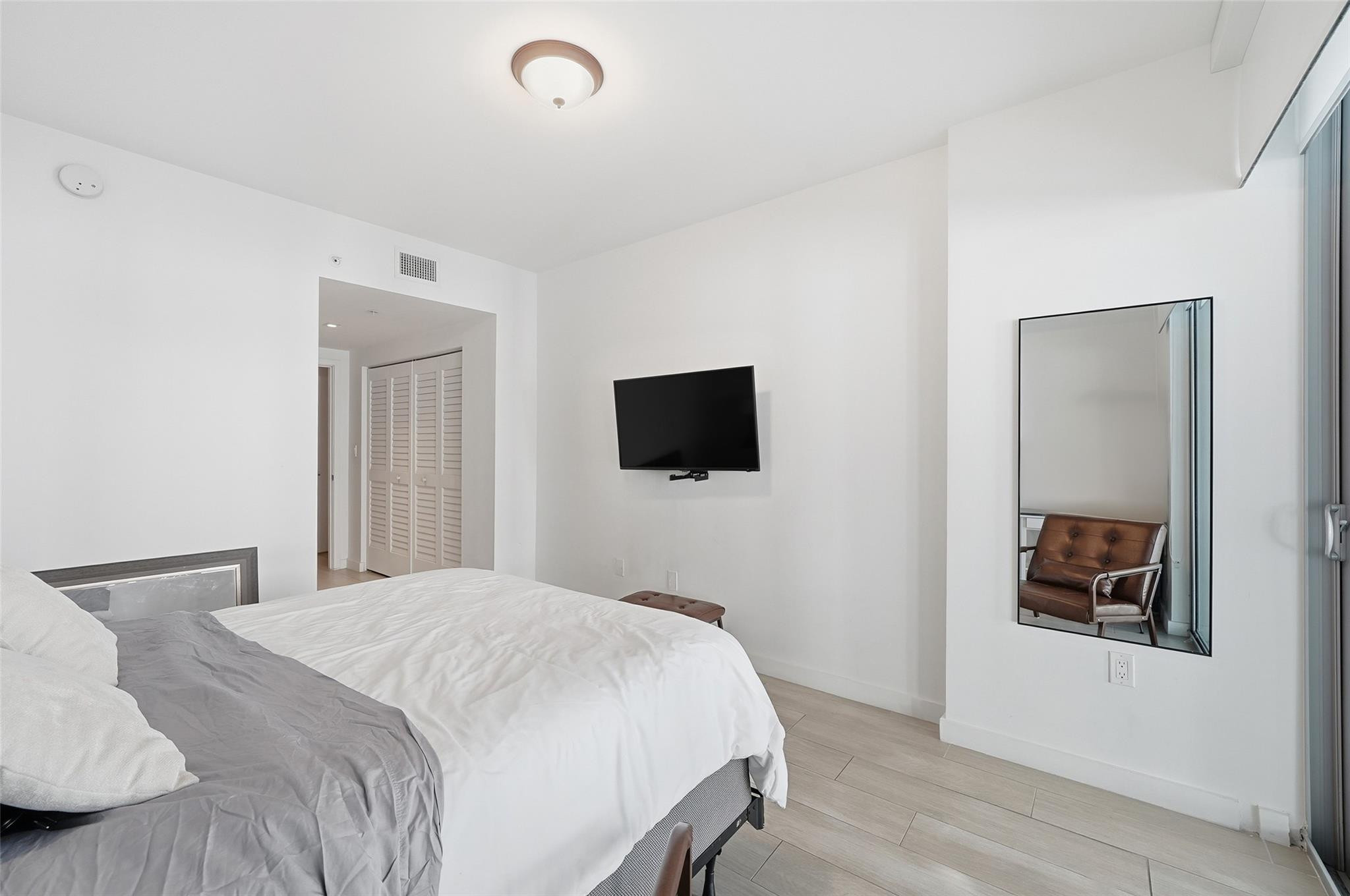 1600 Southwest 1st Avenue, Unit 510 Miami, FL 33129 - Photo 21 of 75 a bedroom with a bed and a flat screen tv