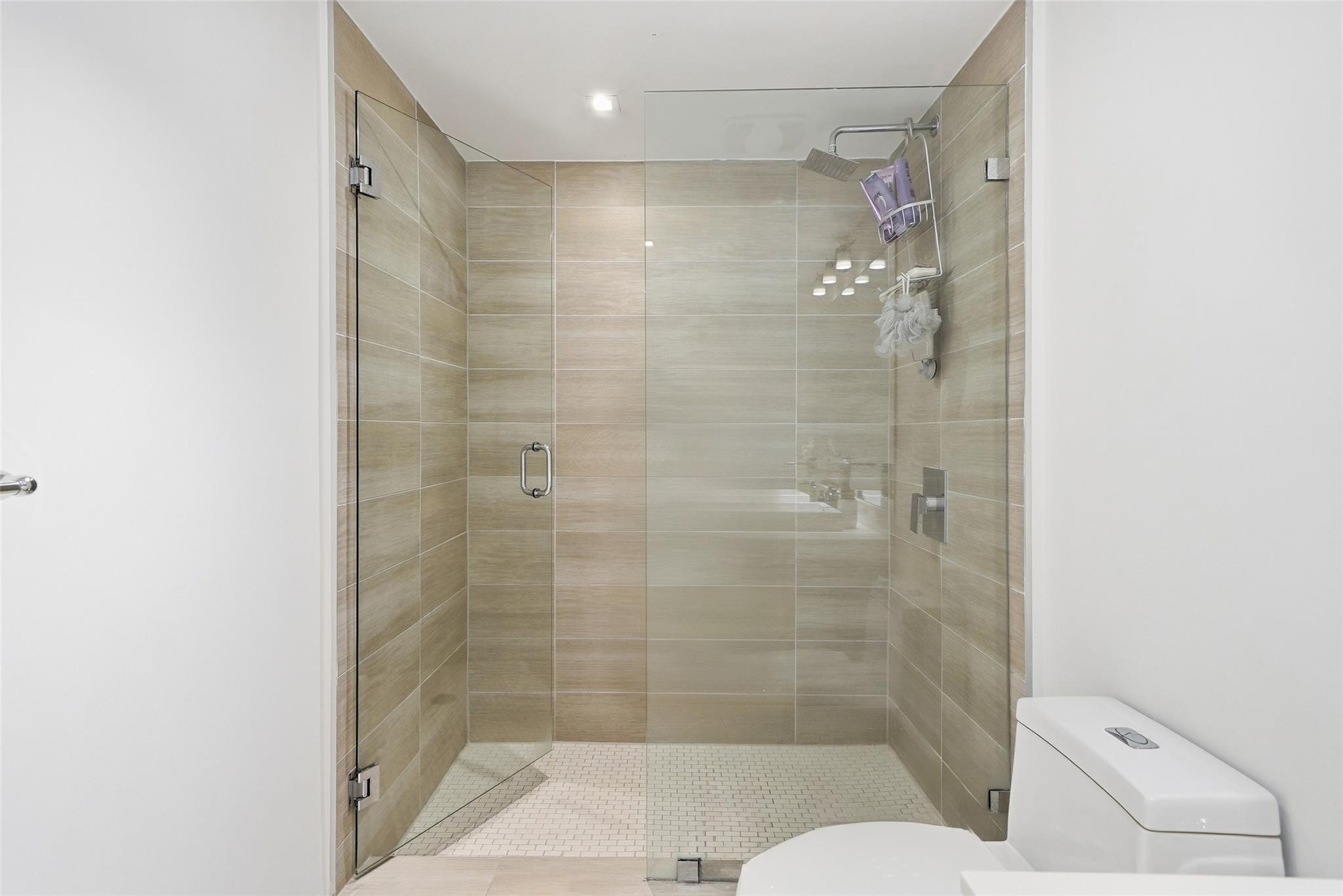 1600 Southwest 1st Avenue, Unit 510 Miami, FL 33129 - Photo 23 of 75 a bathroom with a shower and toilet