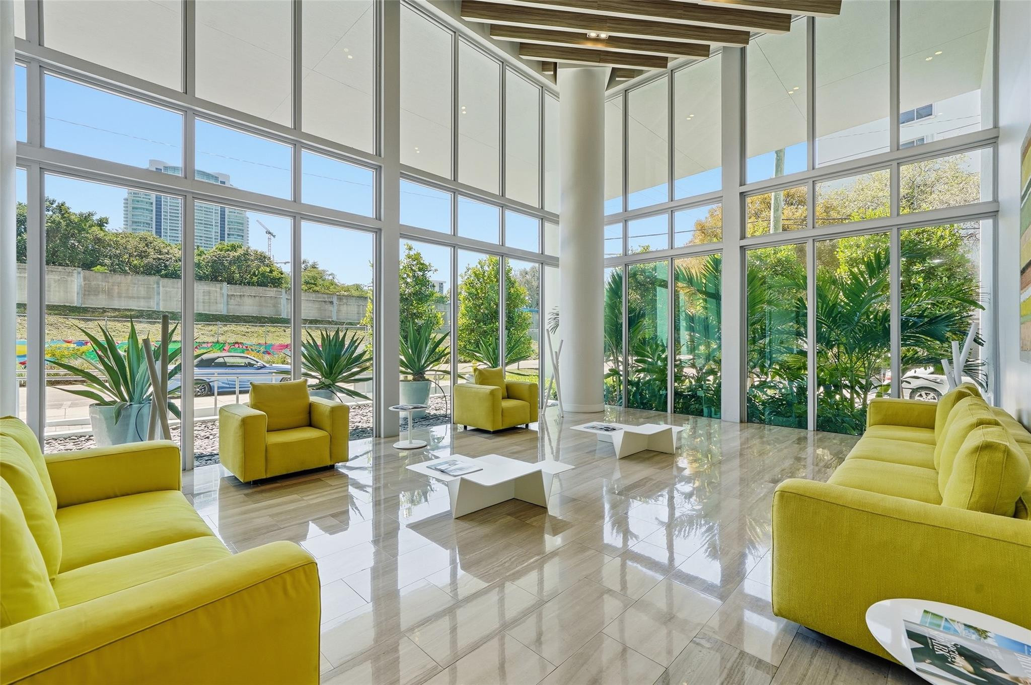 1600 Southwest 1st Avenue, Unit 510 Miami, FL 33129 - Photo 49 of 75 a living room with furniture and floor to ceiling windows