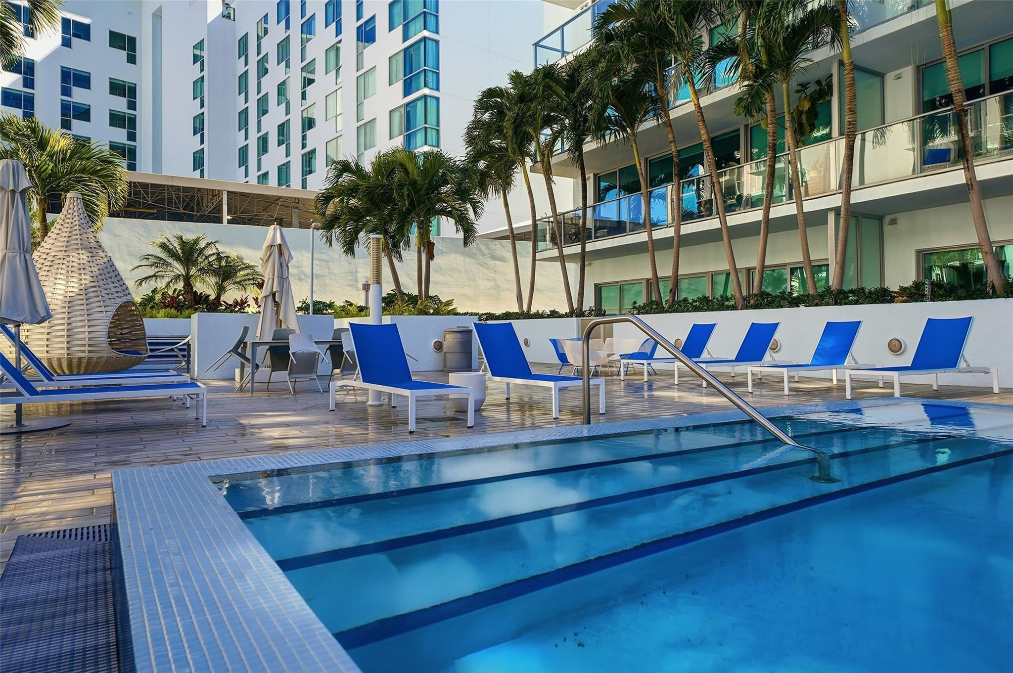 1600 Southwest 1st Avenue, Unit 510 Miami, FL 33129 - Photo 57 of 75 a view of outdoor space with seating area and car parked