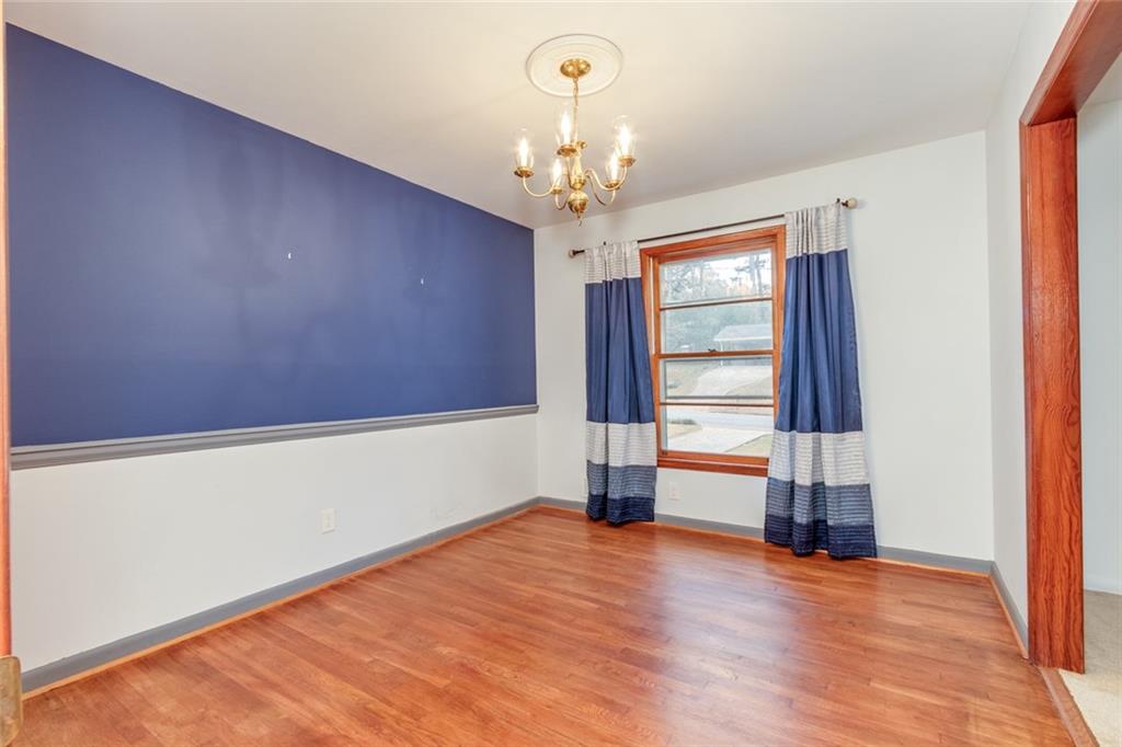 4424 Locksley Road Tucker, GA 30084 - Photo 13 of 50 wooden floor in an empty room with a window