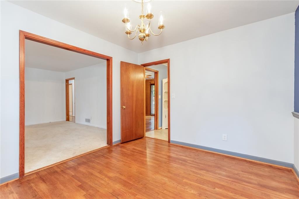 4424 Locksley Road Tucker, GA 30084 - Photo 15 of 50 a view of an empty room with wooden floor