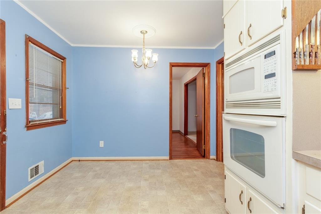 4424 Locksley Road Tucker, GA 30084 - Photo 20 of 50 a view of an empty room with a fireplace and a window