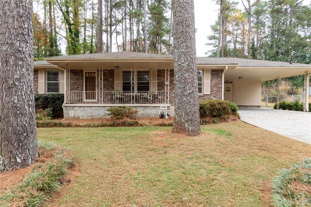 4424 Locksley Road Tucker, GA 30084 - Photo 2 of 50 front view of a house with a yard