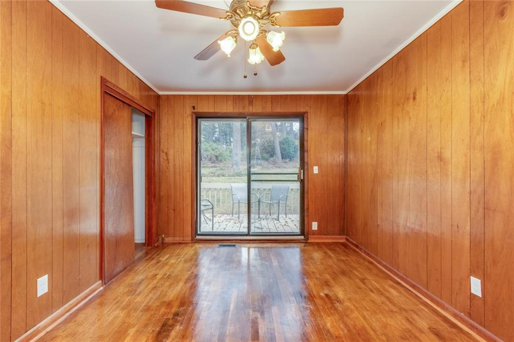 4424 Locksley Road Tucker, GA 30084 - Photo 22 of 50 a view of an empty room with a window and wooden floor