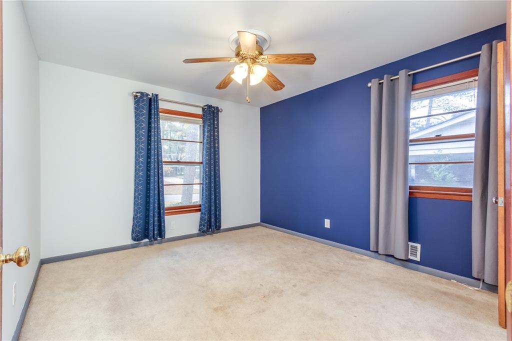 4424 Locksley Road Tucker, GA 30084 - Photo 31 of 50 an empty room with windows and closet