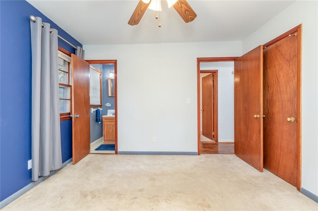 4424 Locksley Road Tucker, GA 30084 - Photo 32 of 50 an empty room with closet and windows