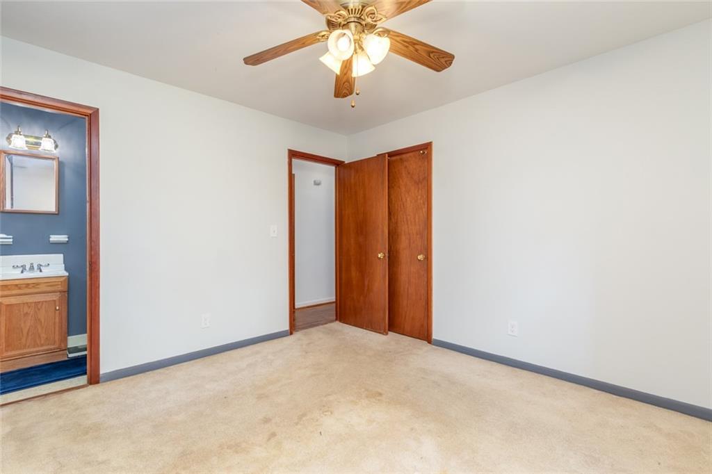 4424 Locksley Road Tucker, GA 30084 - Photo 33 of 50 a view of entryway and hall with a chandelier fan