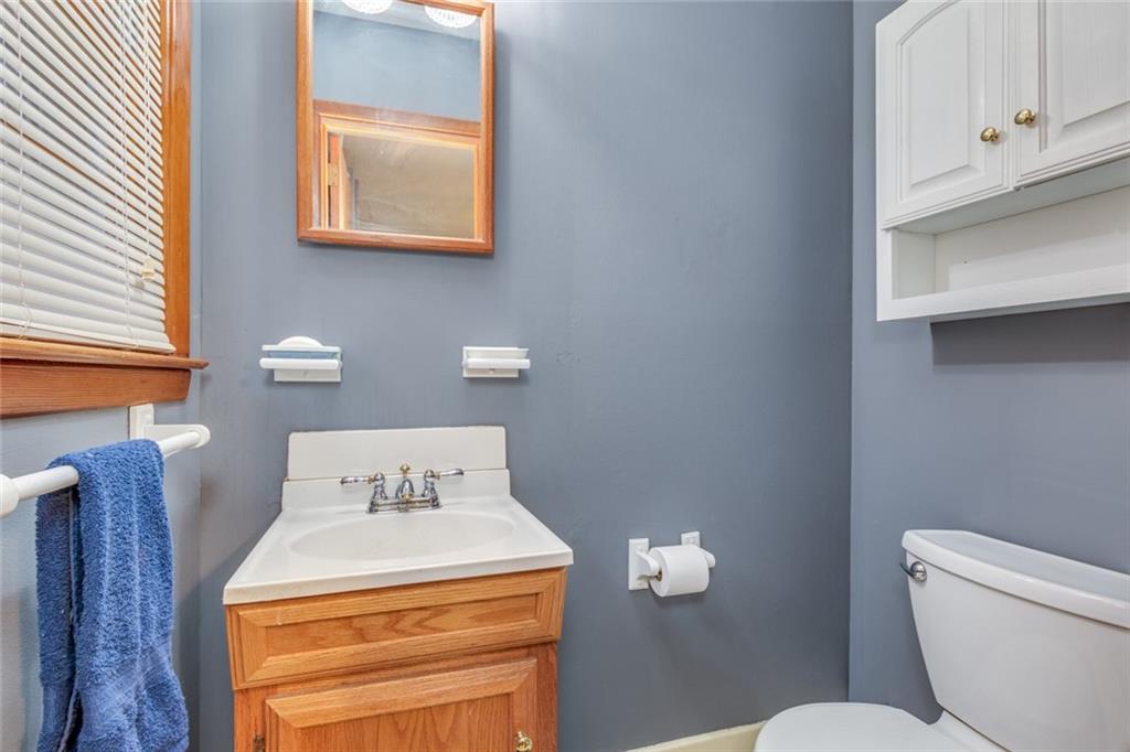 4424 Locksley Road Tucker, GA 30084 - Photo 34 of 50 a bathroom with a toilet and a sink