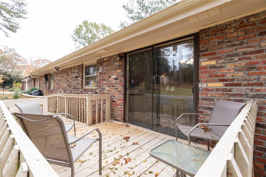 4424 Locksley Road Tucker, GA 30084 - Photo 41 of 50 a view of a balcony with a table and chairs