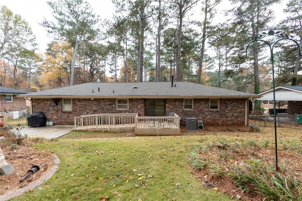 4424 Locksley Road Tucker, GA 30084 - Photo 45 of 50 a front view of a house with garden