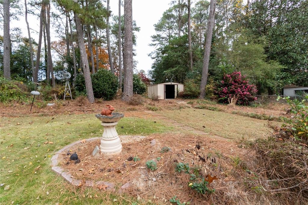 4424 Locksley Road Tucker, GA 30084 - Photo 46 of 50 a view of a backyard with table and chairs