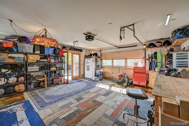 a living room with lots of furniture and a chandelier