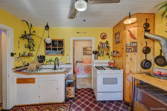 a bathroom with a sink mirror vanity and toilet