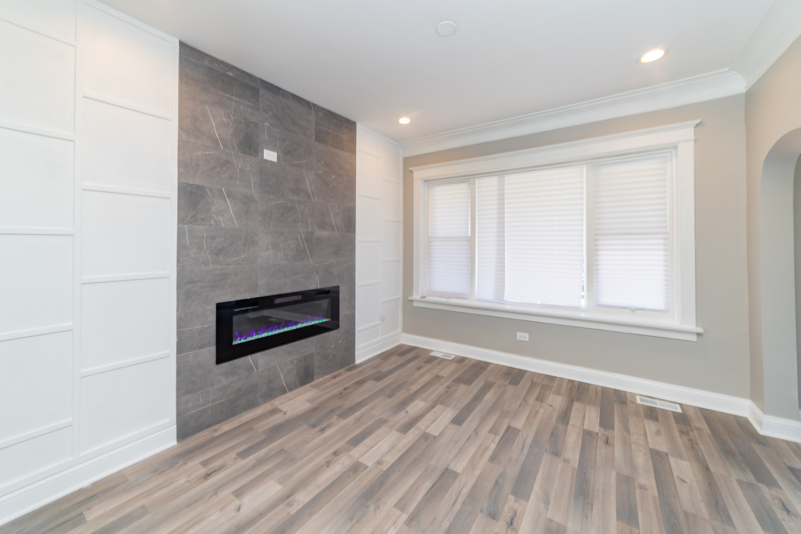 7227 South Indiana Avenue Chicago, IL 60619 - Photo 5 of 21 wooden floor in an empty room with a window