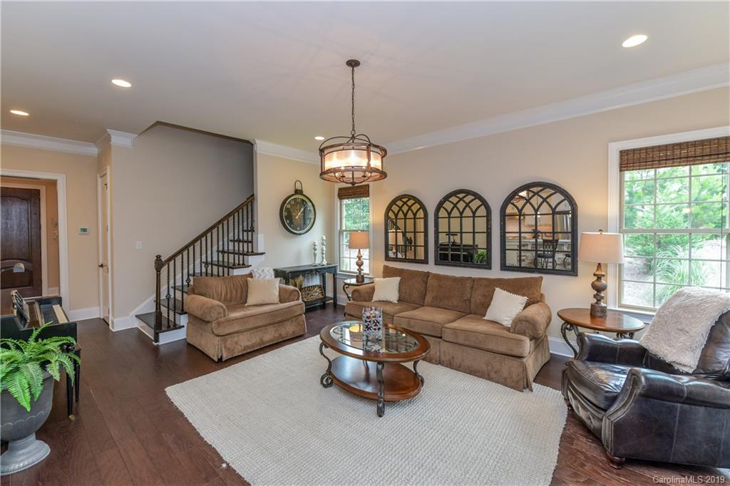615 Pomegranate Place Fort Mill, SC 29708 - Photo 12 of 34 a living room with furniture ceiling fan and a large window