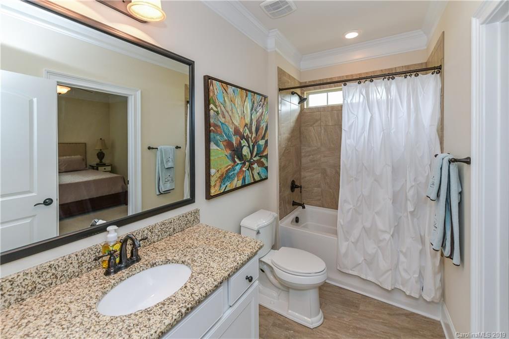 615 Pomegranate Place Fort Mill, SC 29708 - Photo 25 of 34 a bathroom with a granite countertop sink toilet and shower