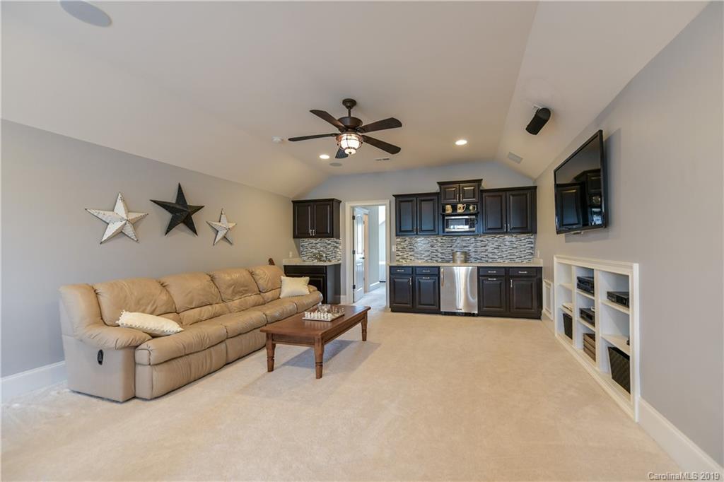 615 Pomegranate Place Fort Mill, SC 29708 - Photo 27 of 34 a living room with furniture and kitchen view