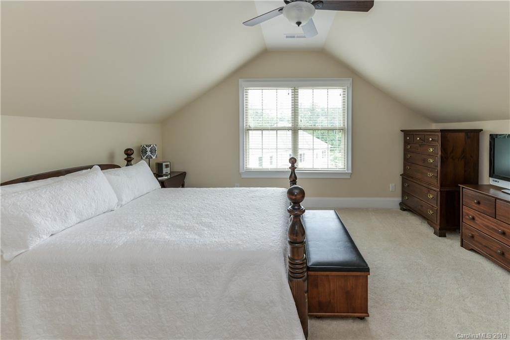 615 Pomegranate Place Fort Mill, SC 29708 - Photo 30 of 34 a bed room with a bed and a television