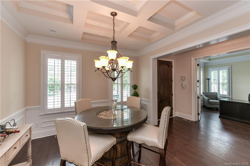615 Pomegranate Place Fort Mill, SC 29708 - Photo 4 of 34 a view of a dining room with furniture wooden floor and chandelier