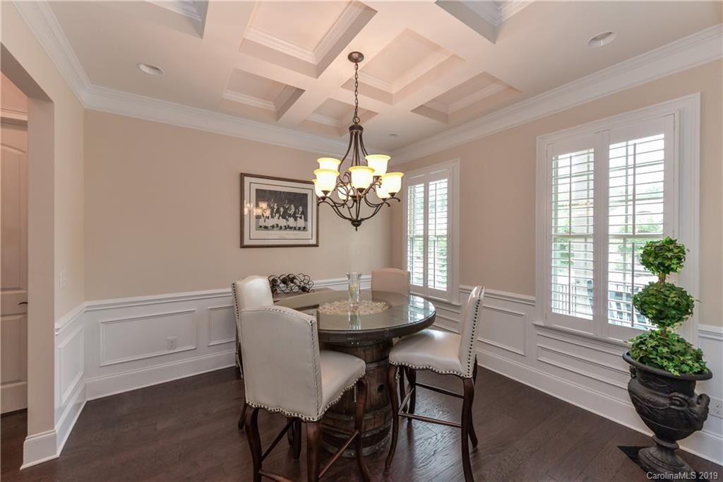 615 Pomegranate Place Fort Mill, SC 29708 - Photo 5 of 34 a dining room with furniture a chandelier and a window