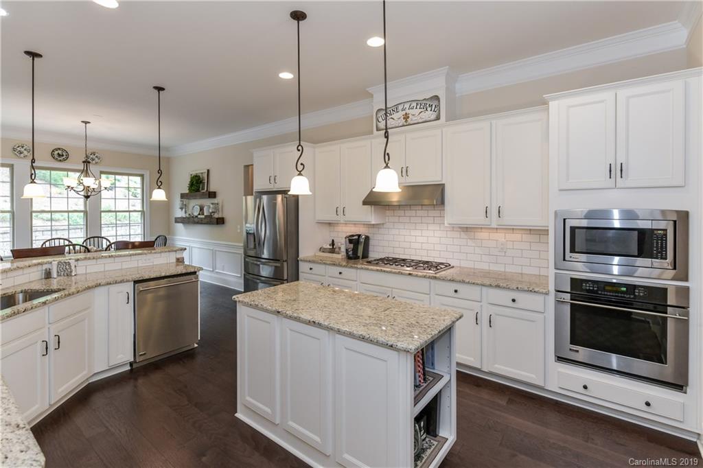 615 Pomegranate Place Fort Mill, SC 29708 - Photo 7 of 34 a kitchen with a sink stove and refrigerator