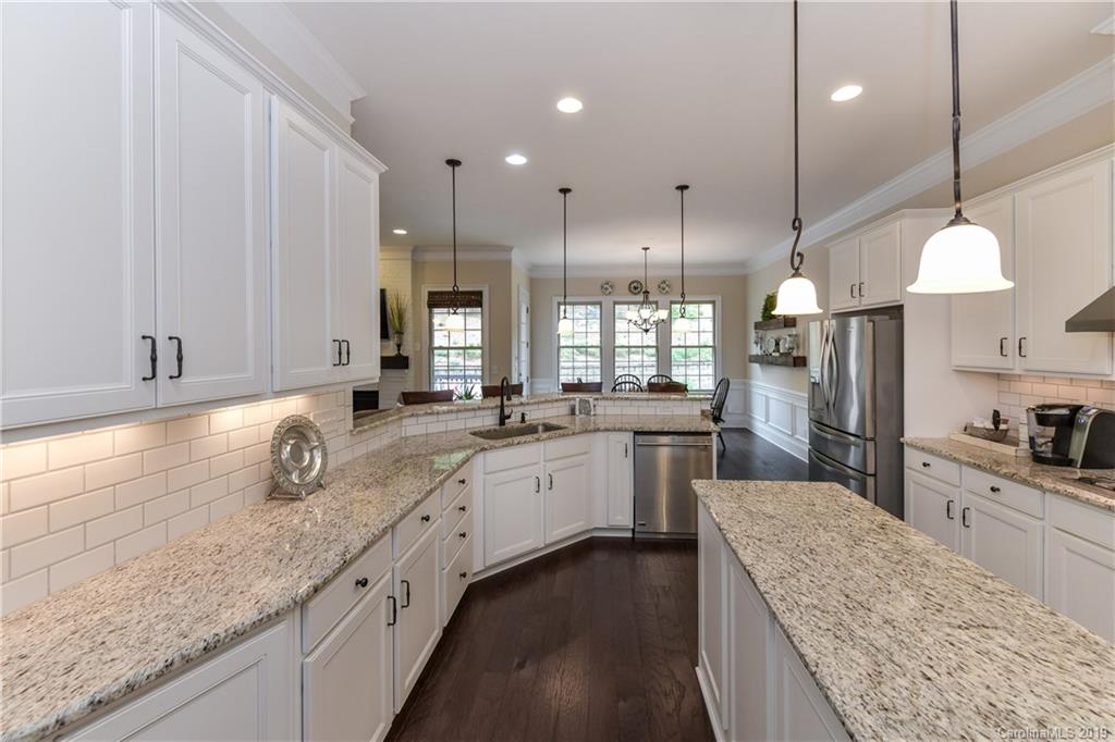 615 Pomegranate Place Fort Mill, SC 29708 - Photo 8 of 34 a large kitchen with granite countertop lots of counter space sink and refrigerator