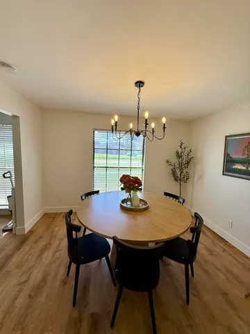 a view of a dining table and chairs in the room