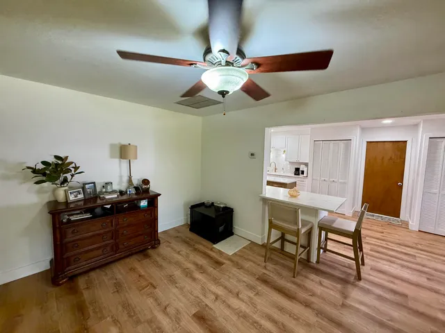 a workspace with furniture and wooden floor
