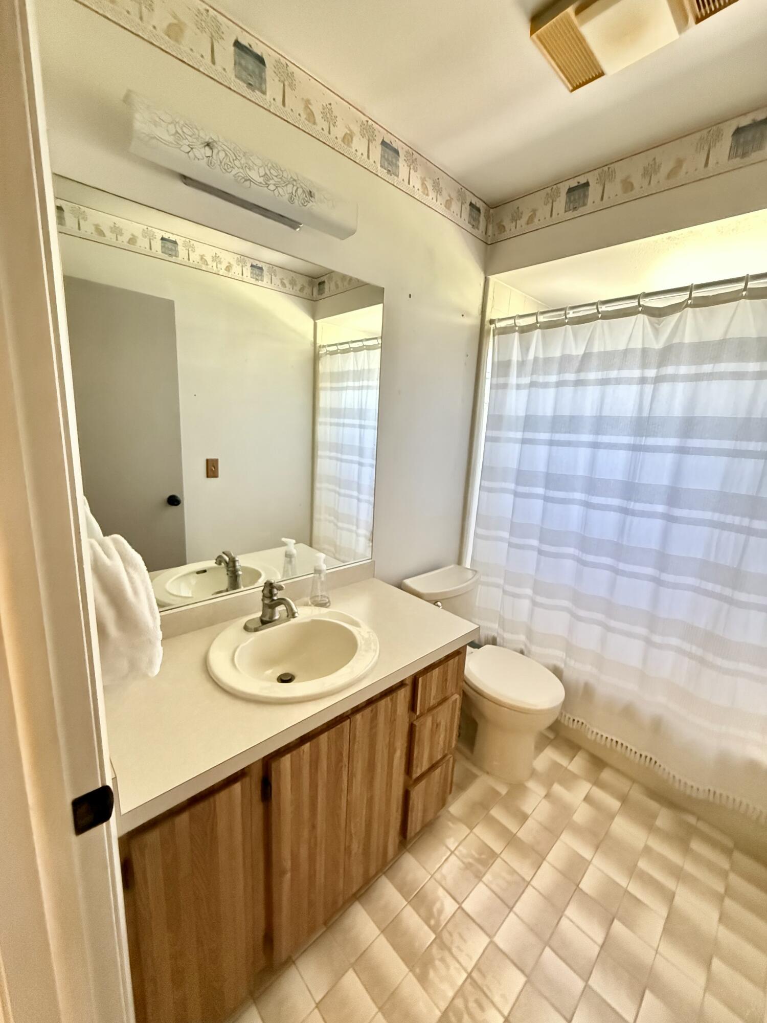411 West Avenida Del Rio Clewiston, FL 33440 - Photo 23 of 29 a bathroom with a sink a toilet and shower