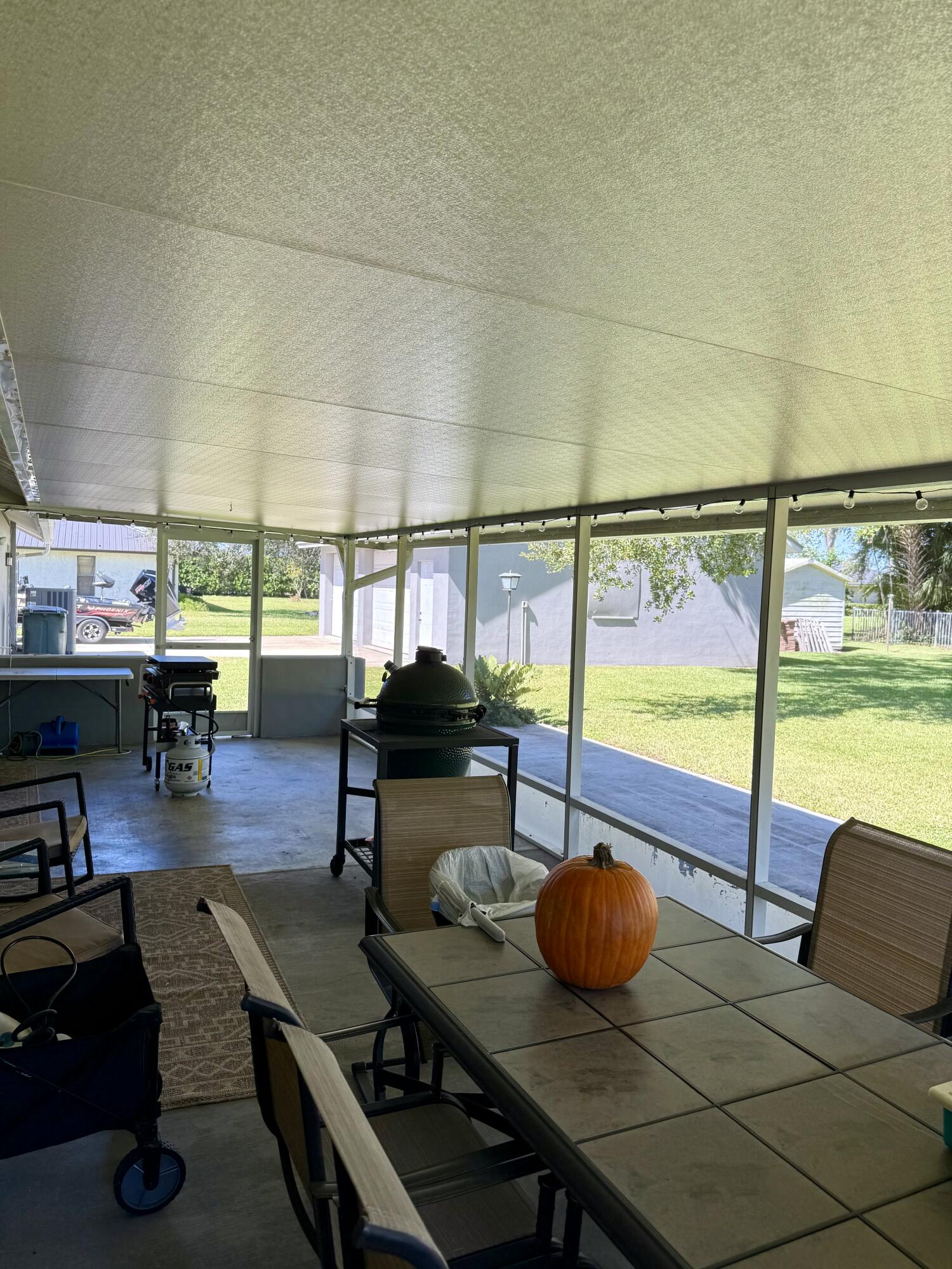 411 West Avenida Del Rio Clewiston, FL 33440 - Photo 24 of 29 a living room with furniture and a floor to ceiling window