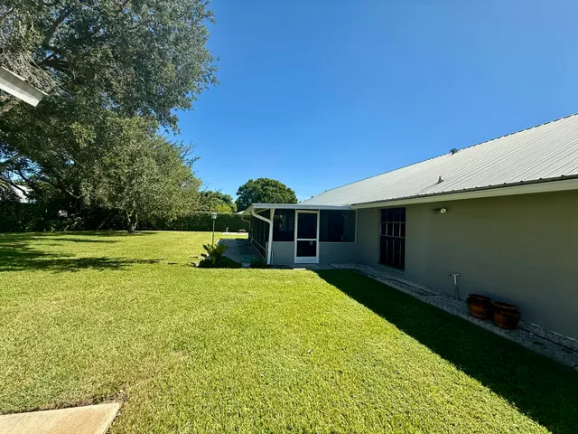 a view of a backyard with hardwood