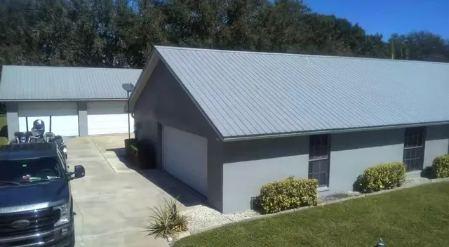 a view of a house with a yard and garage