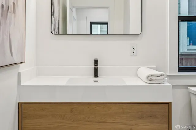 a kitchen with stainless steel appliances kitchen island granite countertop a stove a sink and a refrigerator