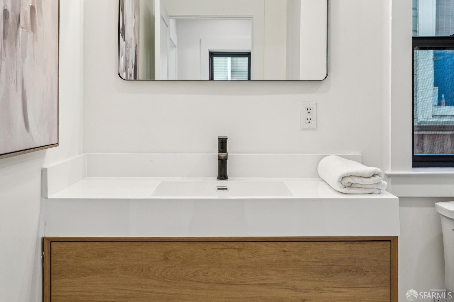 2411 Sixth Street Berkeley, CA 94710 - Photo 13 of 72 a bathroom with a sink and a mirror