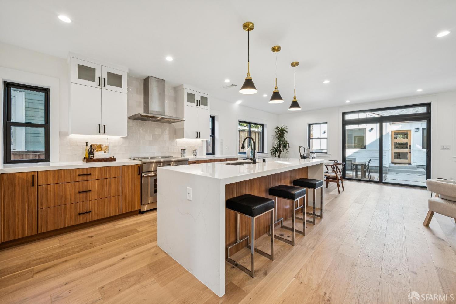 2411 Sixth Street Berkeley, CA 94710 - Photo 18 of 72 a large kitchen with lots of counter space a sink appliances and living room view