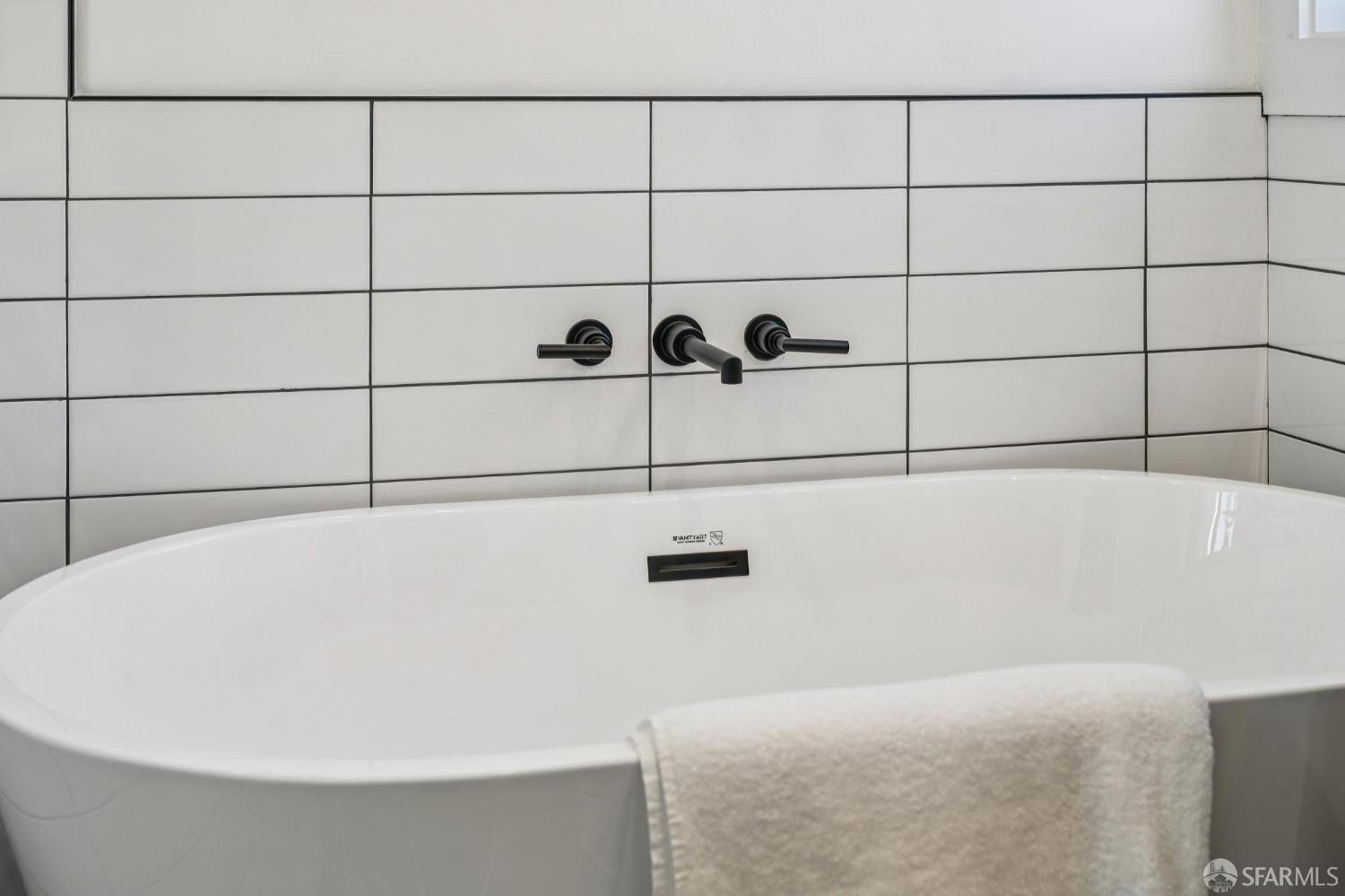 2411 Sixth Street Berkeley, CA 94710 - Photo 46 of 72 a bathroom with a bathtub