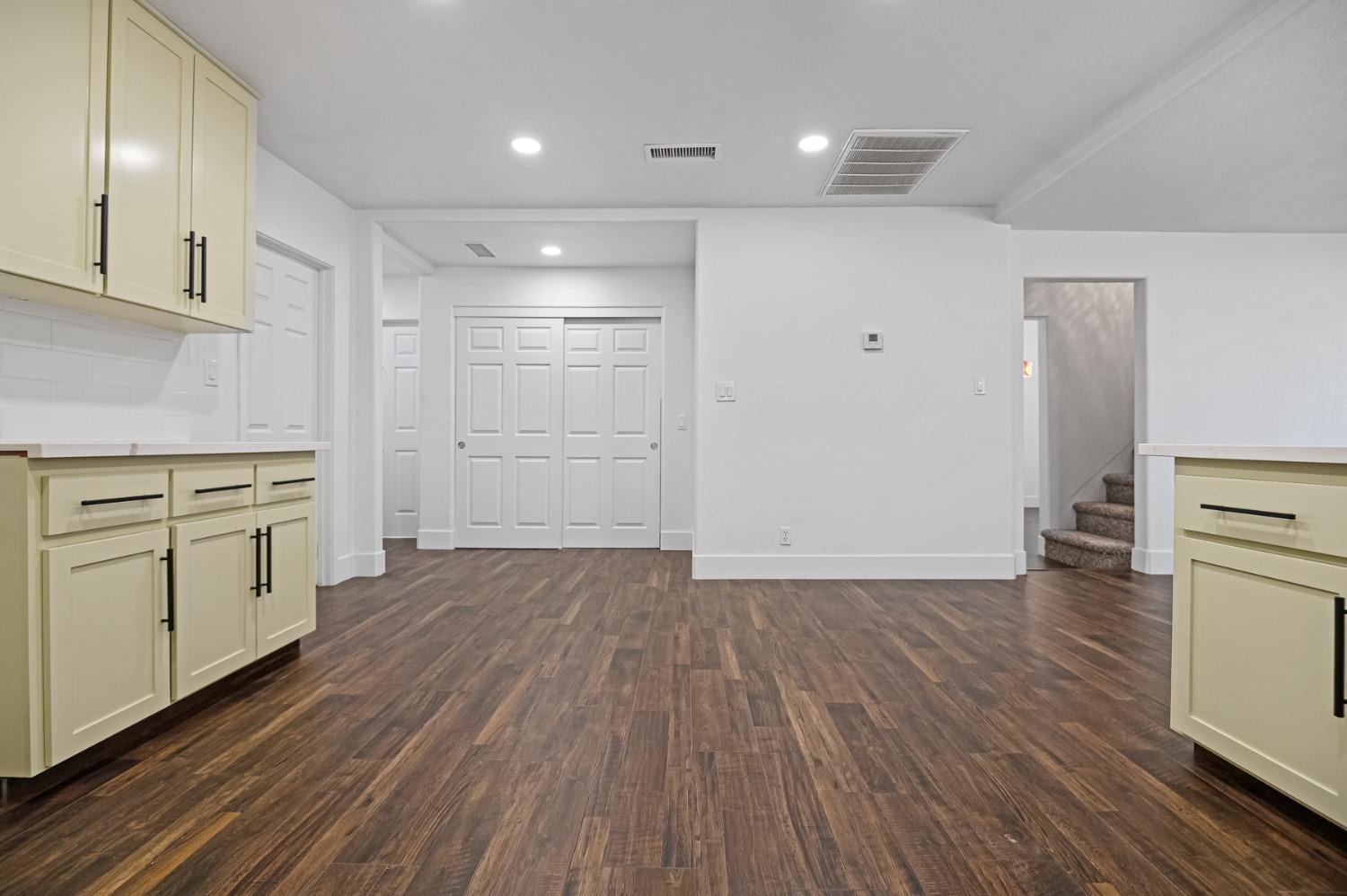 325 West Bush Street Lemoore, CA 93245 - Photo 16 of 55 a view of a kitchen with wooden floor