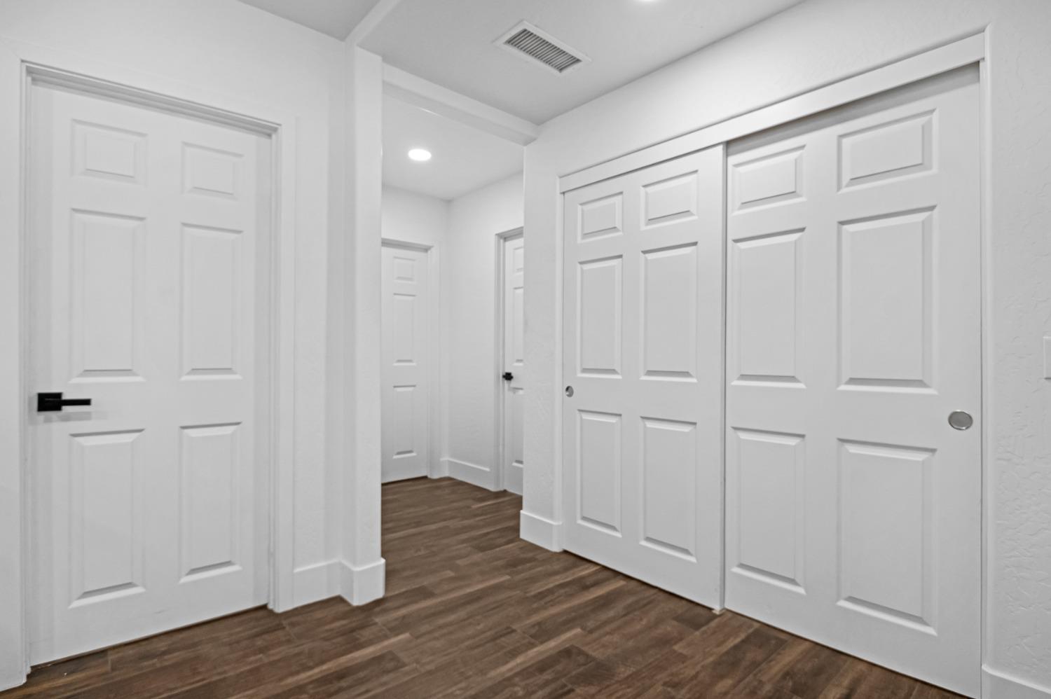 325 West Bush Street Lemoore, CA 93245 - Photo 17 of 55 wooden floor with white walls
