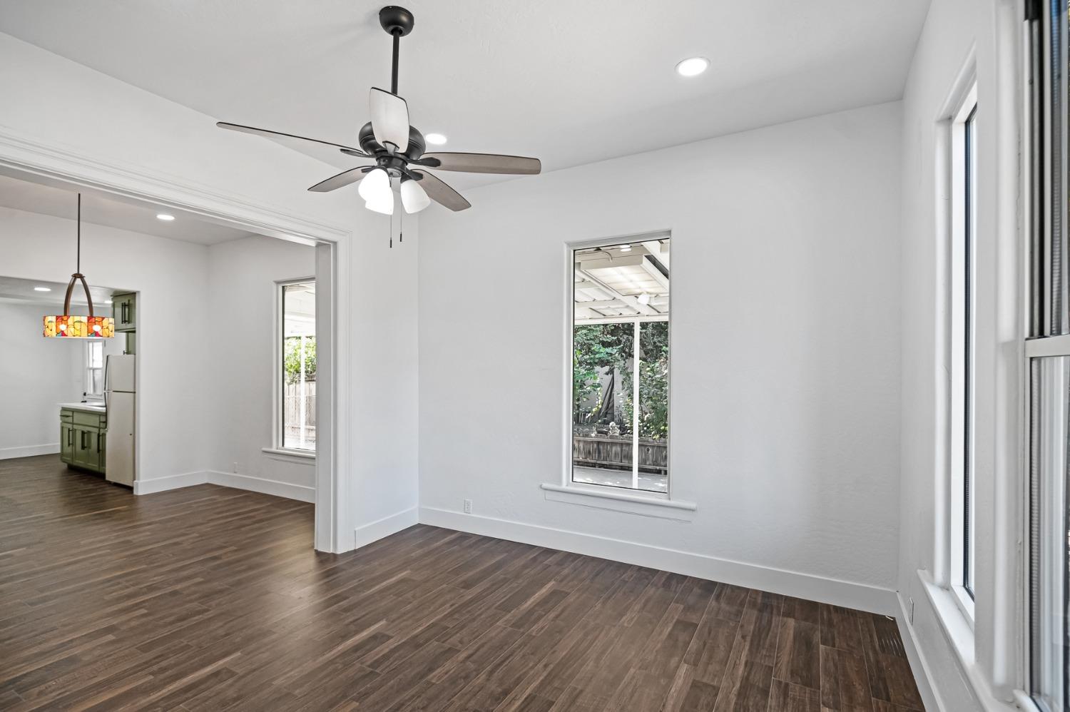 325 West Bush Street Lemoore, CA 93245 - Photo 31 of 55 wooden floor in an empty room with a window