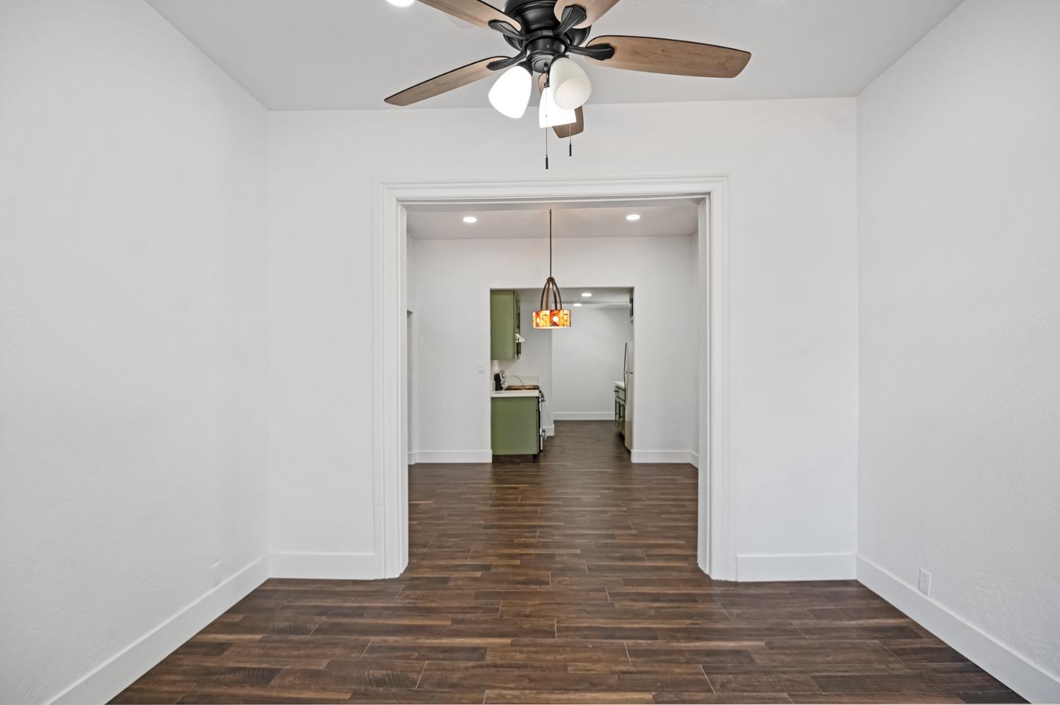 325 West Bush Street Lemoore, CA 93245 - Photo 33 of 55 a view of empty room with wooden floor
