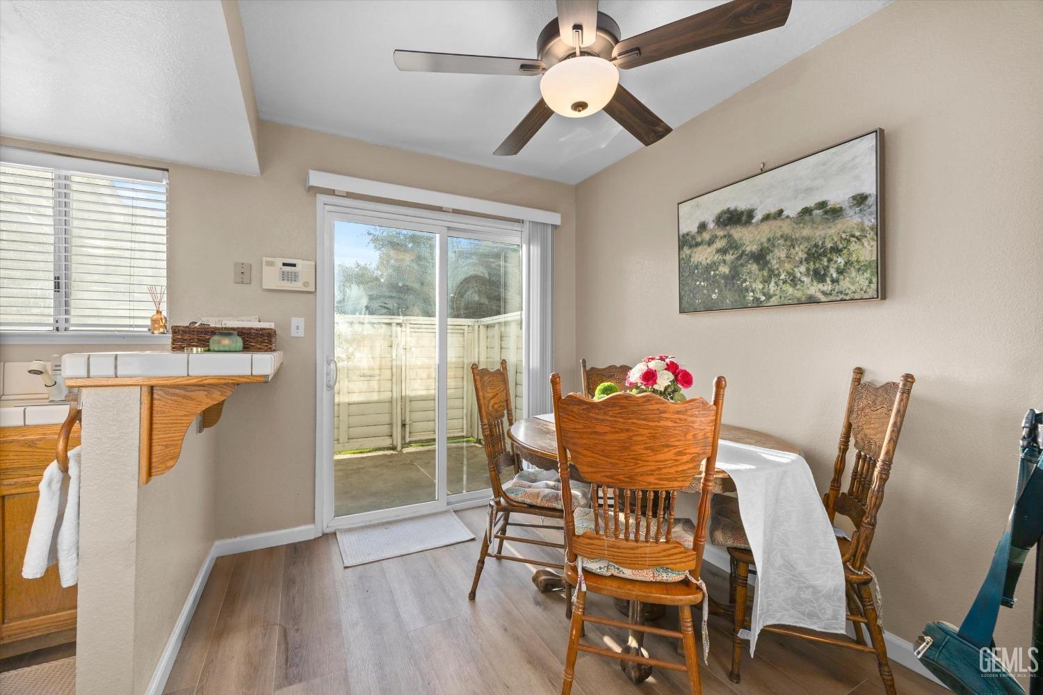 Undisclosed Address Bakersfield, CA 93311 - Photo 11 of 30 a view of a dining room with furniture window and wooden floor