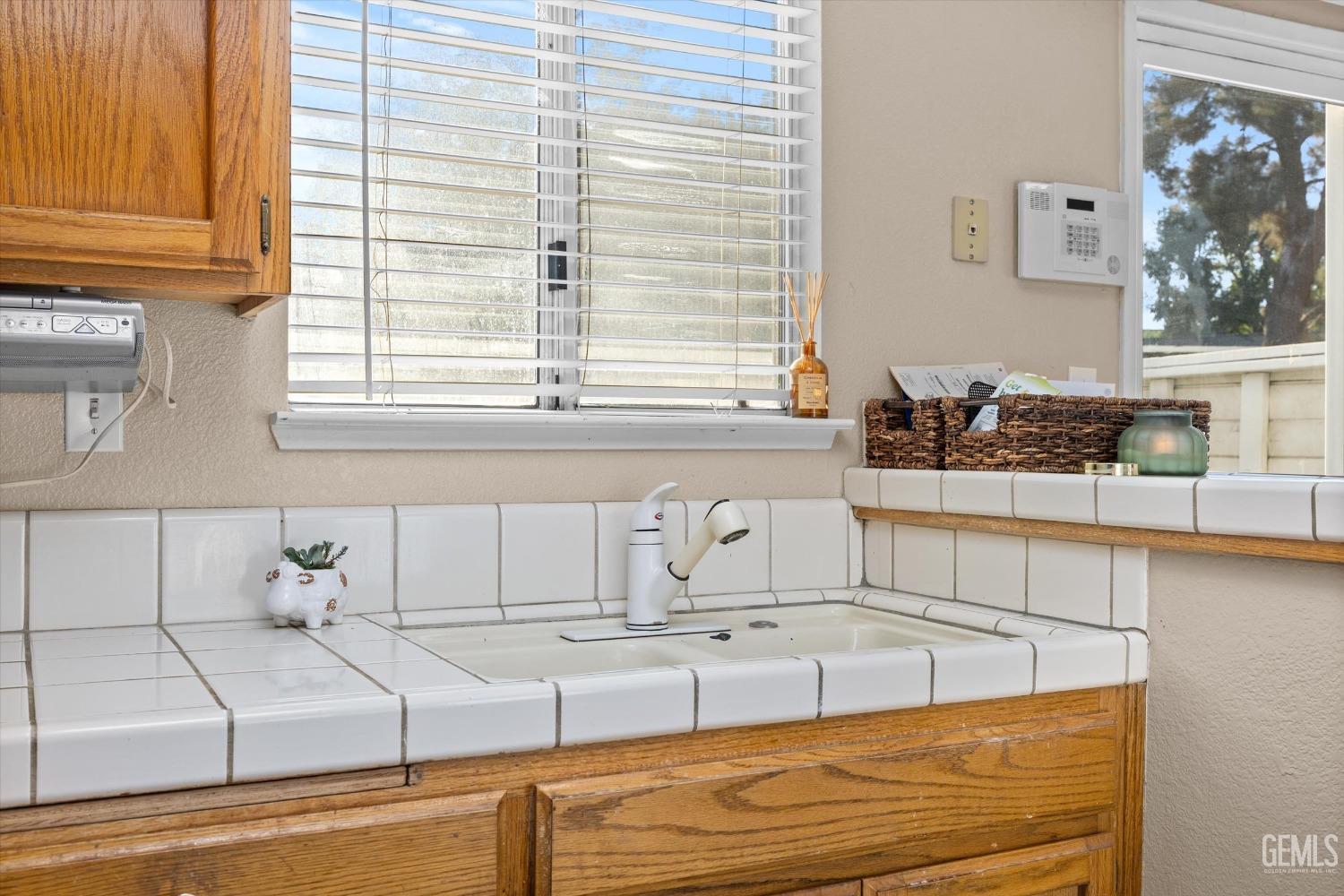 Undisclosed Address Bakersfield, CA 93311 - Photo 14 of 30 a view of a kitchen sink and cabinet