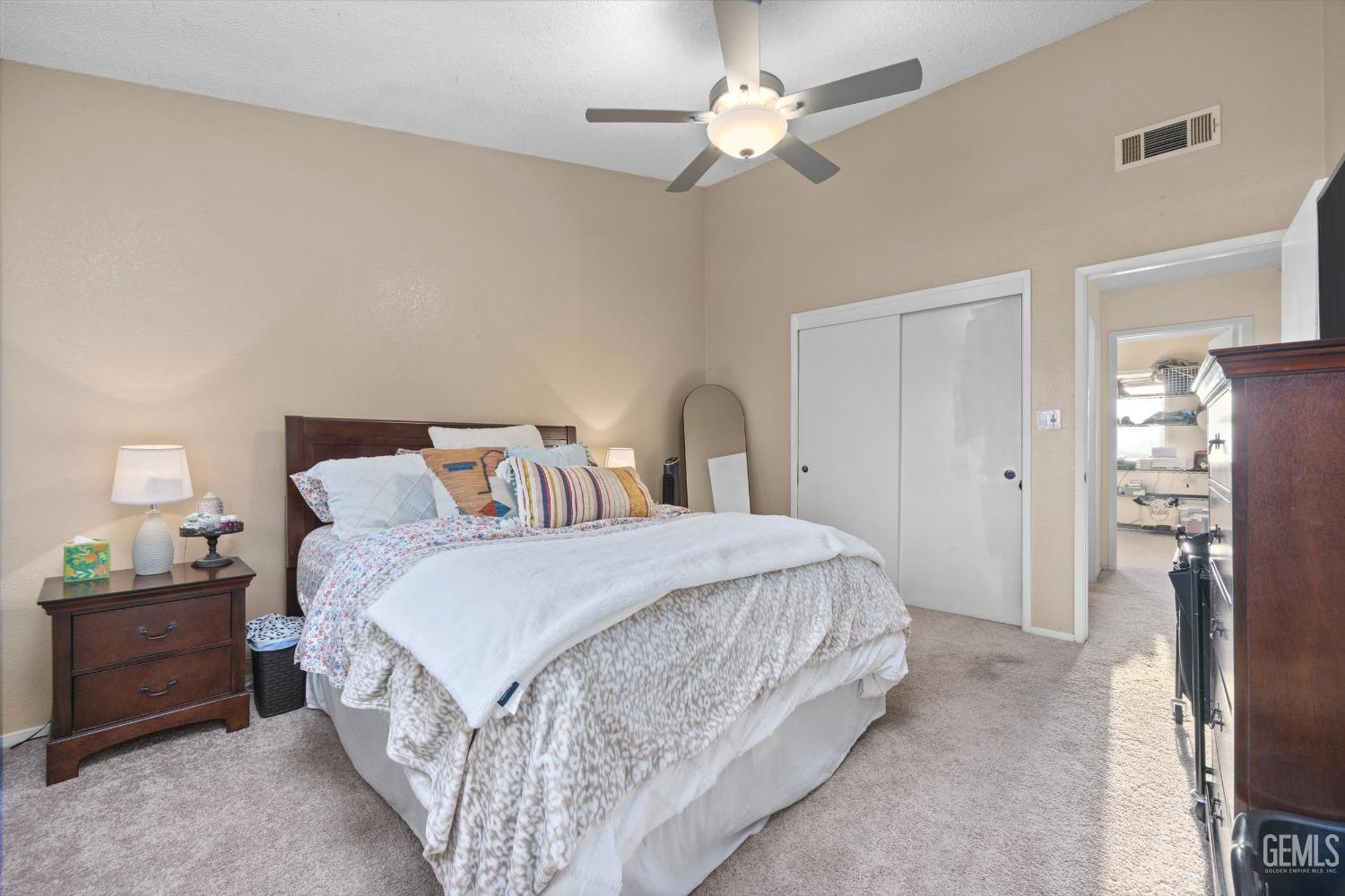 Undisclosed Address Bakersfield, CA 93311 - Photo 18 of 30 a bedroom with a bed and a chandelier