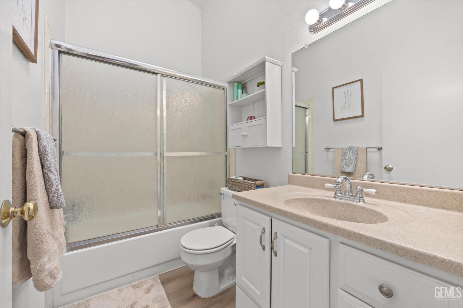 Undisclosed Address Bakersfield, CA 93311 - Photo 19 of 30 a bathroom with a sink a toilet and shower
