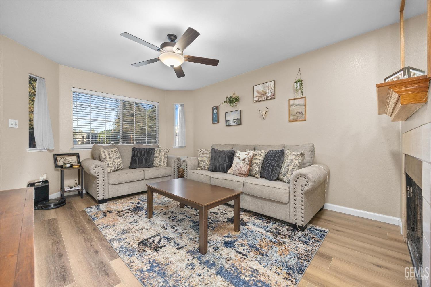 Undisclosed Address Bakersfield, CA 93311 - Photo 7 of 30 a living room with furniture and a large window
