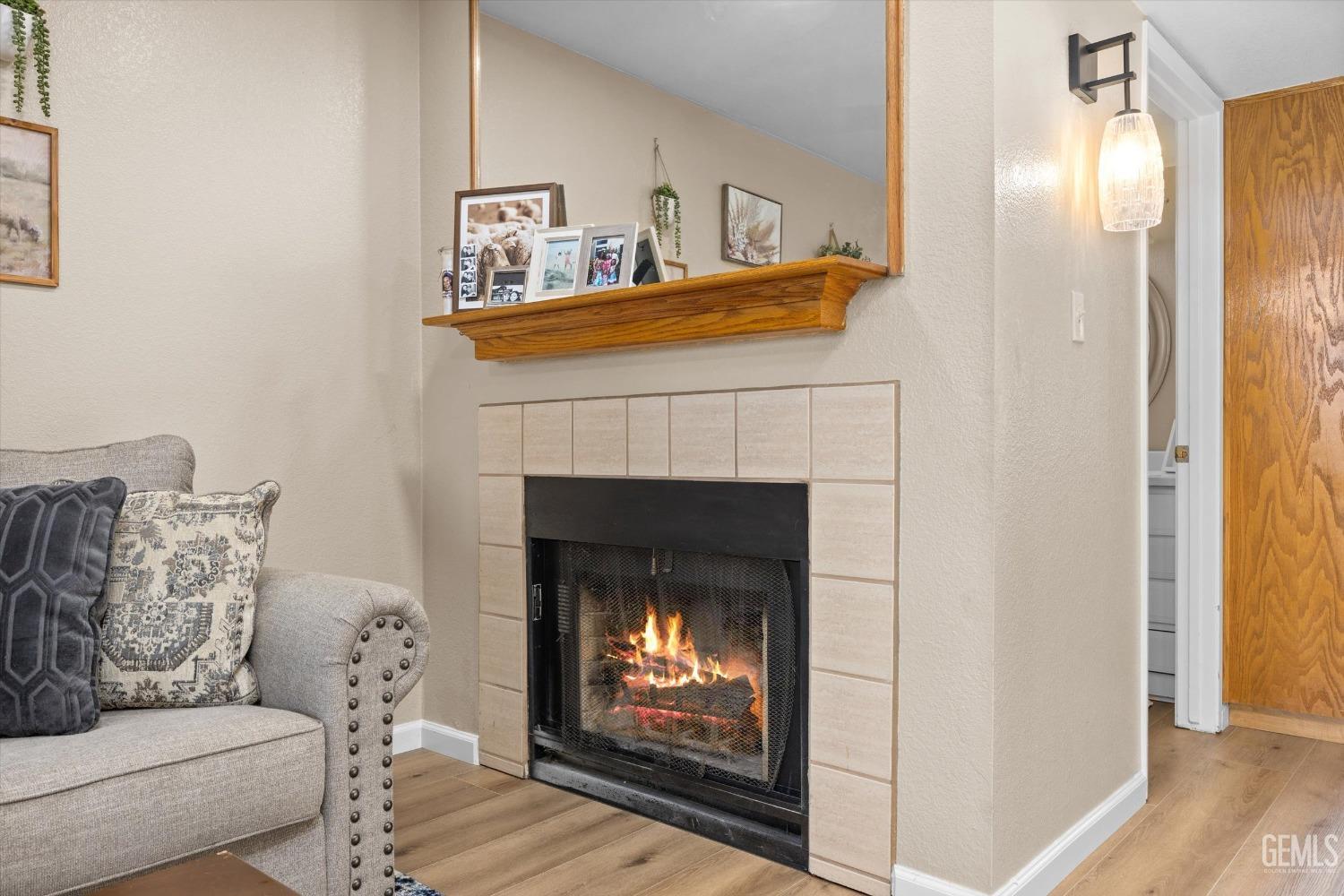 Undisclosed Address Bakersfield, CA 93311 - Photo 8 of 30 a living room with furniture and a fireplace