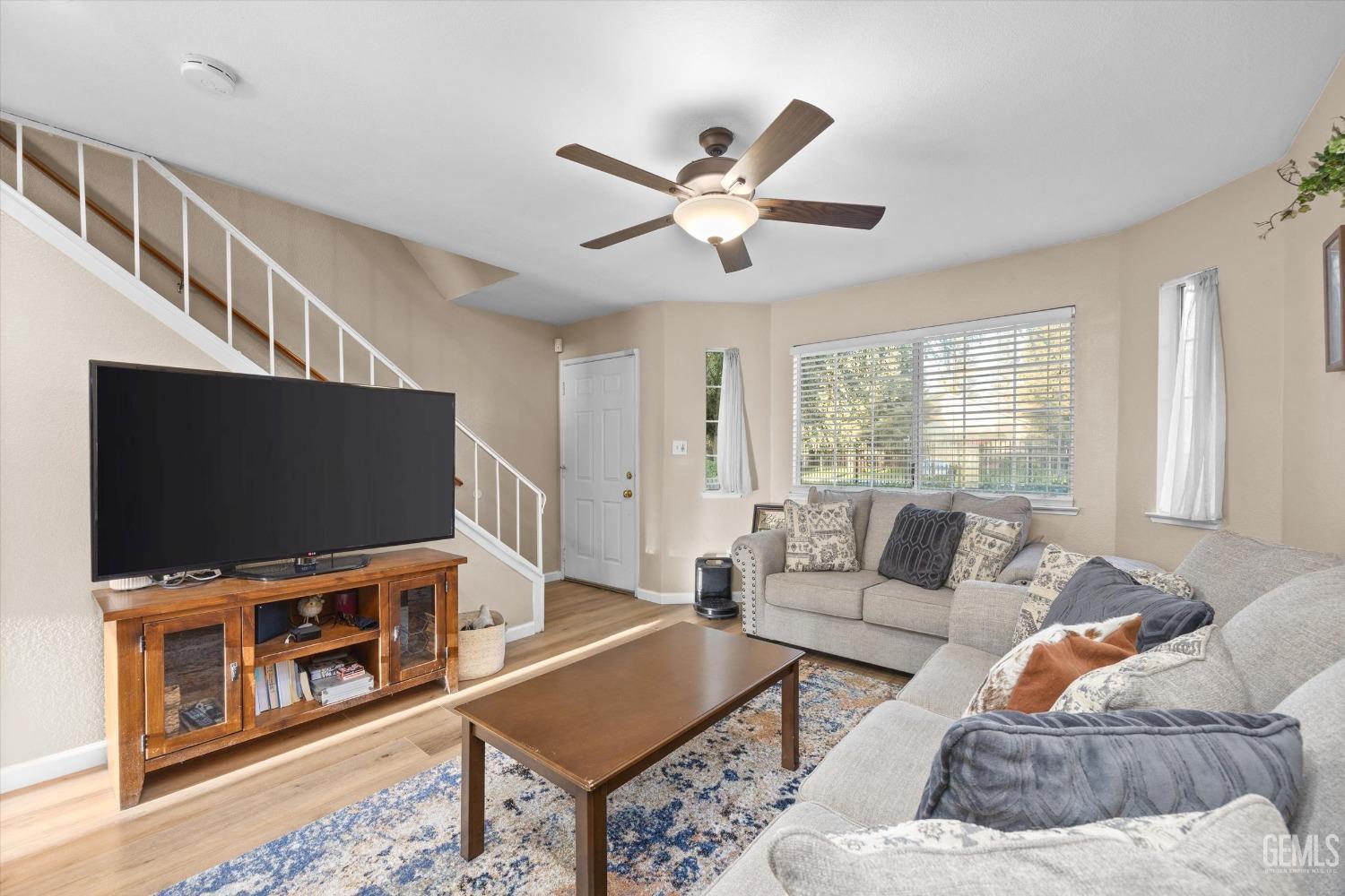Undisclosed Address Bakersfield, CA 93311 - Photo 9 of 30 a living room with furniture and a flat screen tv